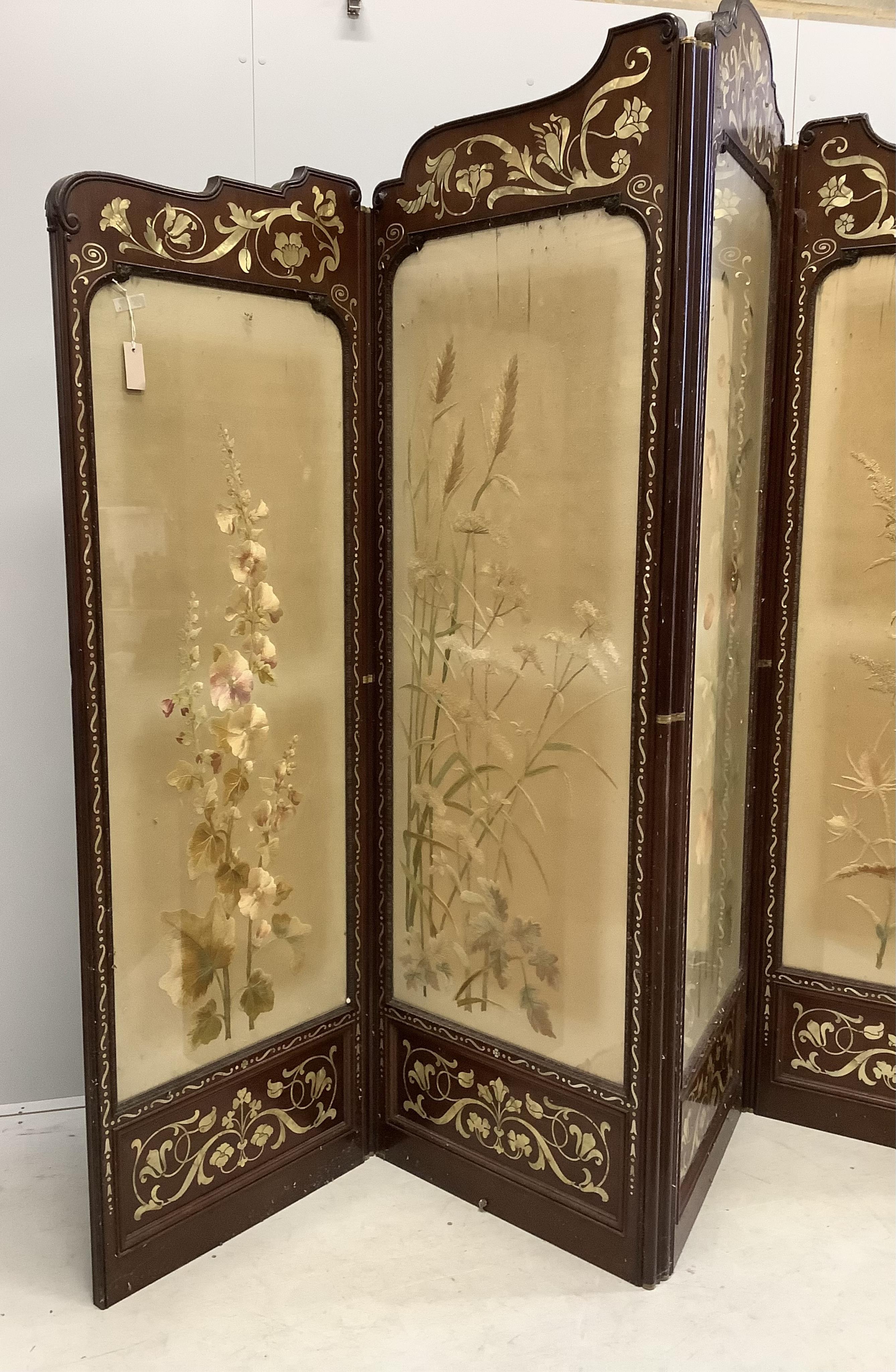 An Art Nouveau mother of pearl inlaid five fold screen, inset silk thread embroidered panels, largest panel width 64cm, height 213cm. Condition - fair to good, one panel poor